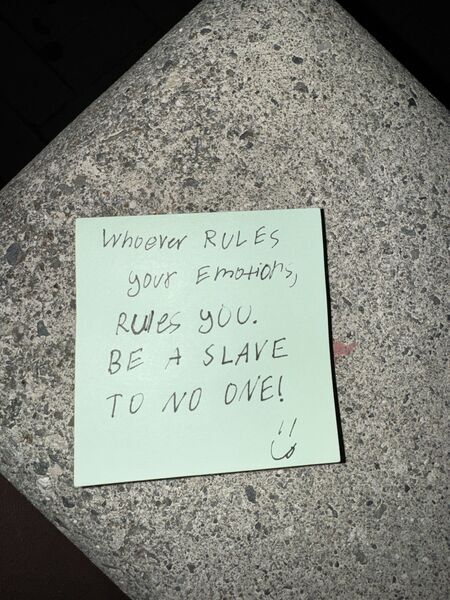 Handwritten sticky note with words of encouragement